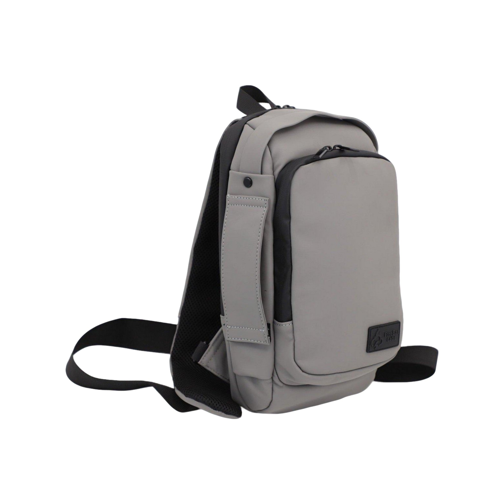 Gray sling bag with black straps on a white background